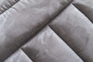 close up of a grey suede sofa