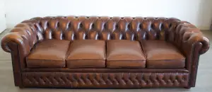 A brown Chesterfield sofa