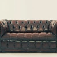 A brown Chesterfield leather couch