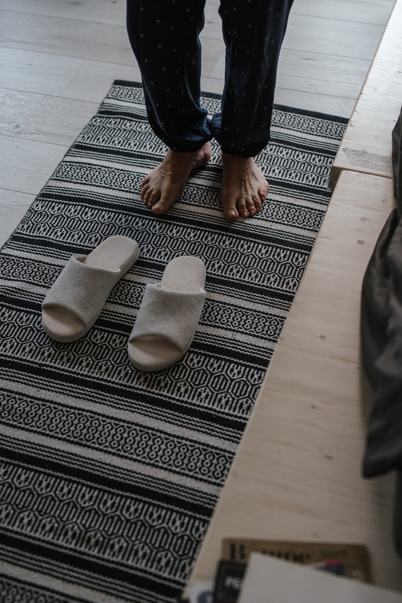 A person standing on a rug